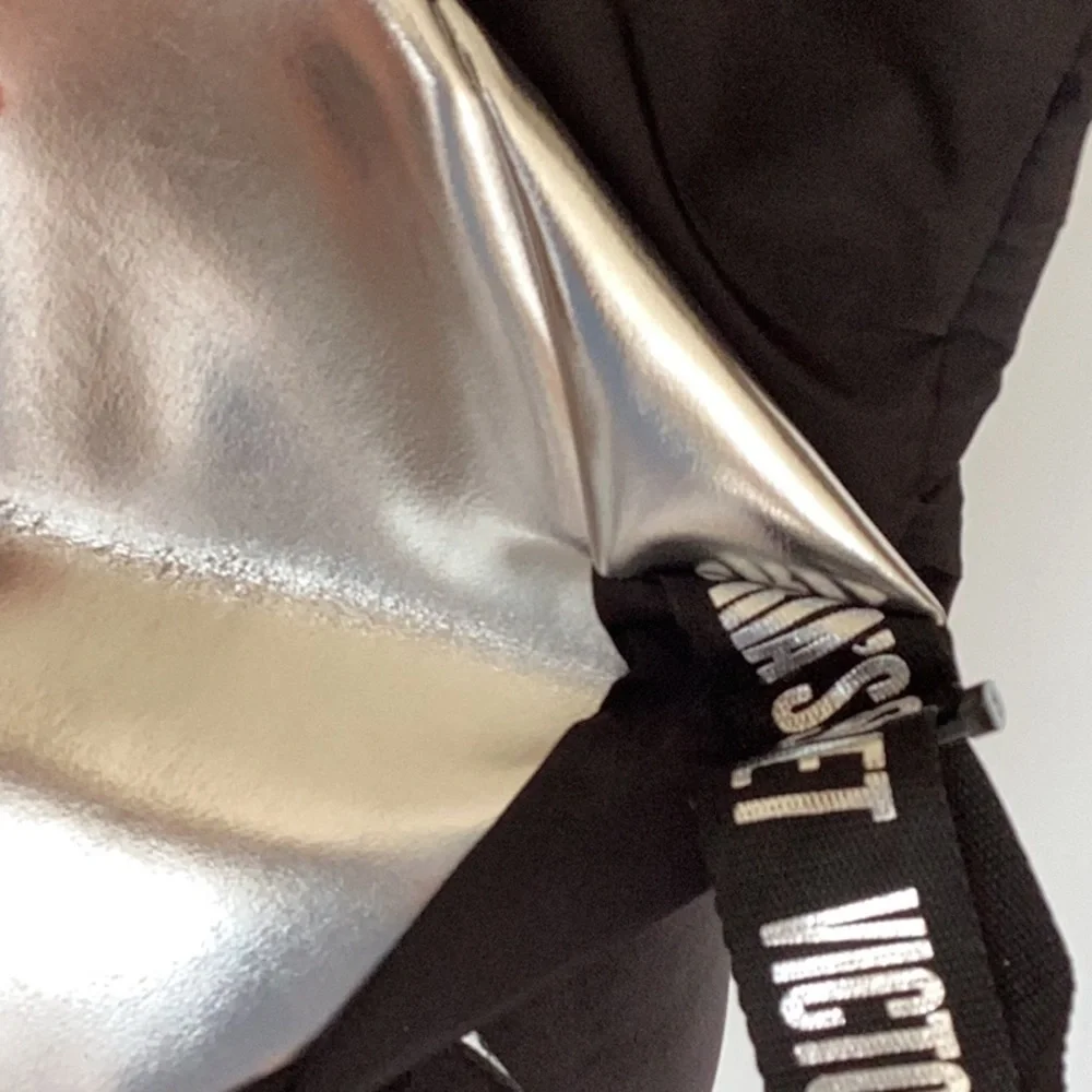 VICTORIA’S Secret black and silver backpack.